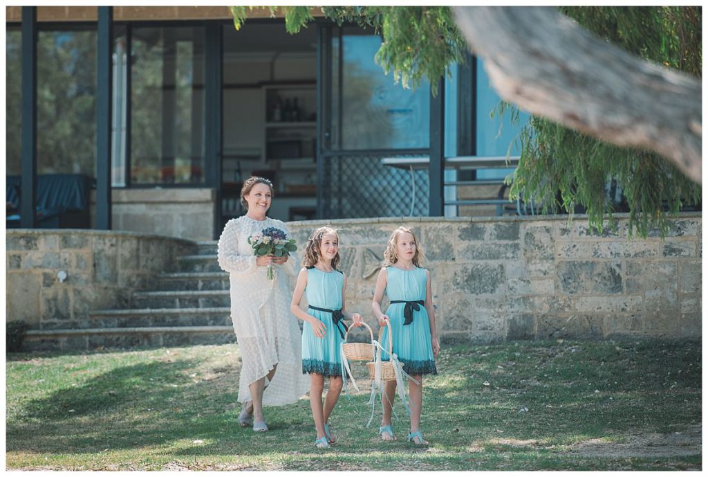 bride-to-be-walks-with-flower-girls-wedding-photo