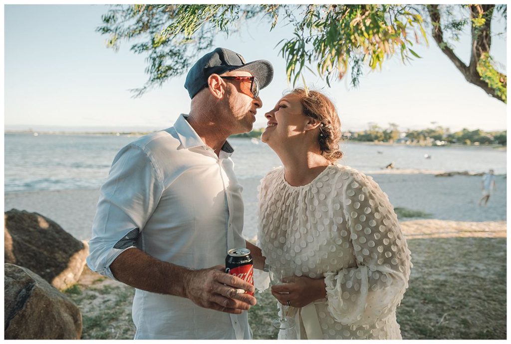 beach-wedding-sunset-kiss-photo