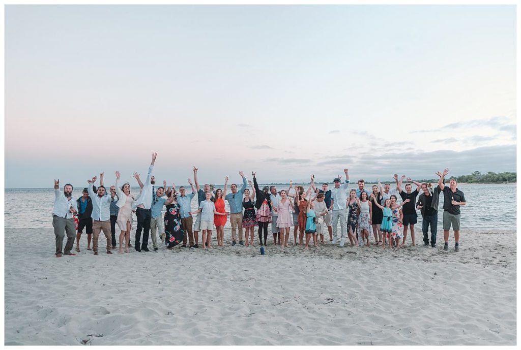 group-wedding-photo-at-the-beach