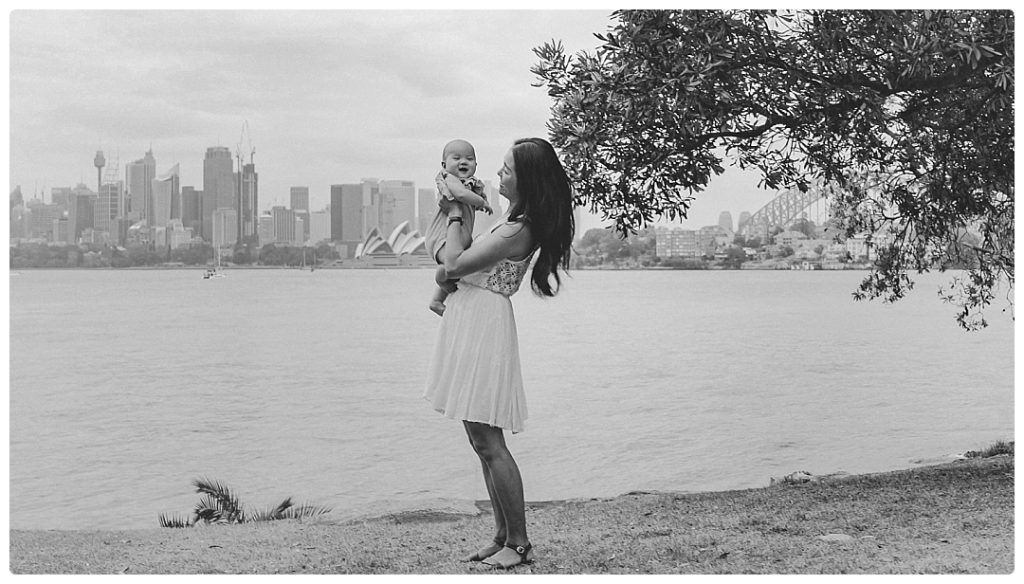 mom-and-babe-look-at-sydney-opera-house-and-harbour-bridge-photo