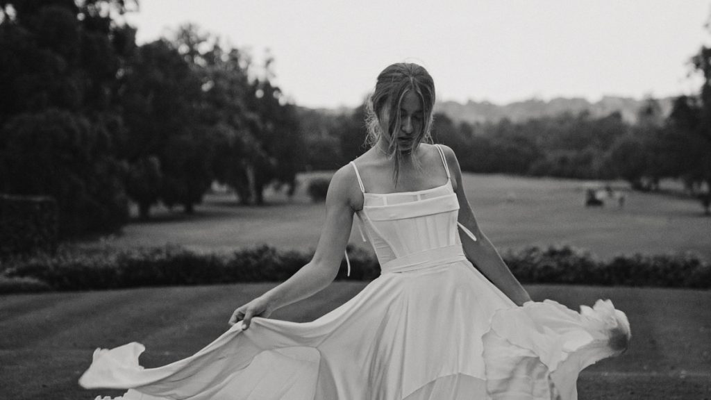 bride-dances-in-white-silk-dress-photo
