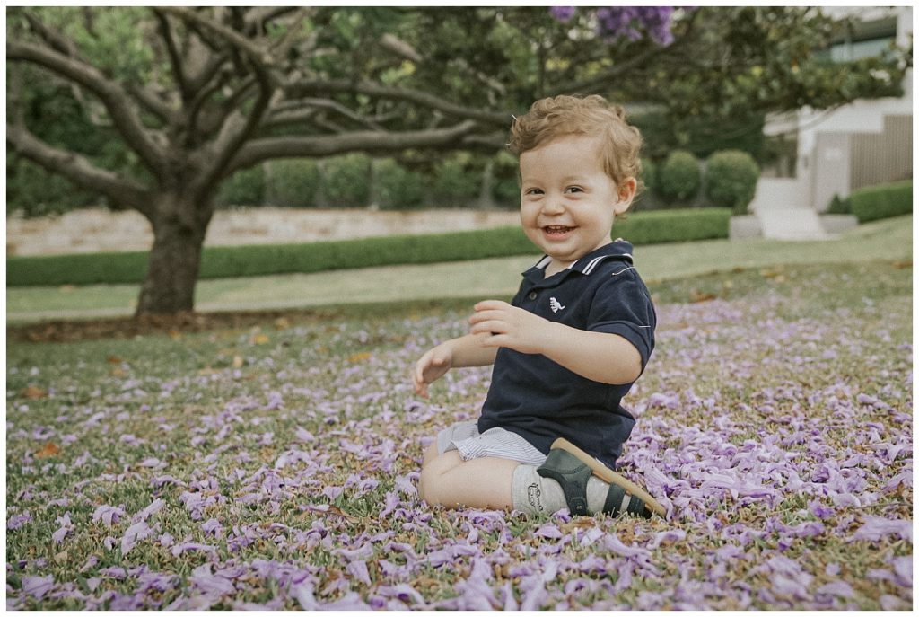 cheeky-boy-in-jacaranda-bloom-photo