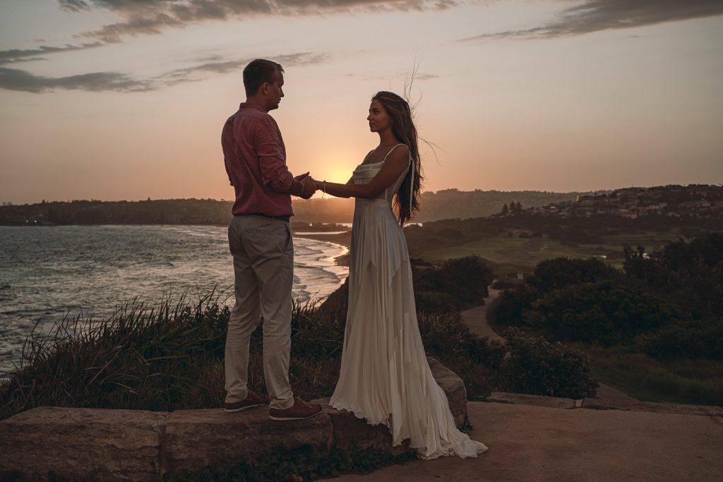 bride-and-groom-hold-their-hands-photo