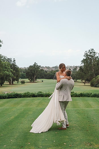 An eloped couple dancing at golf filed in Manly Golf Club, Northern Beaches